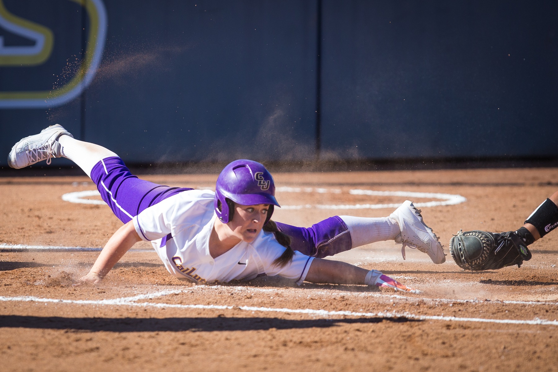 Kendall Marinesi slides into home. Photo by Dave Donovan.