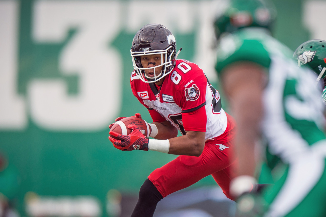 Eric Rogers signs with Calgary Stampeders. (Photo by Johany Jutras/CFLCA)