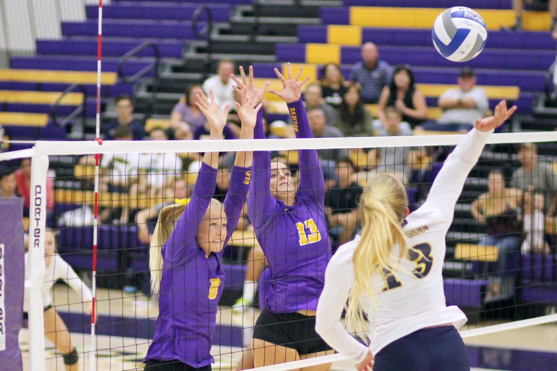 Jamie Smith (L) and Paris Dosch go up for a block against UCSC. (Photo: Tracy L. Olson)