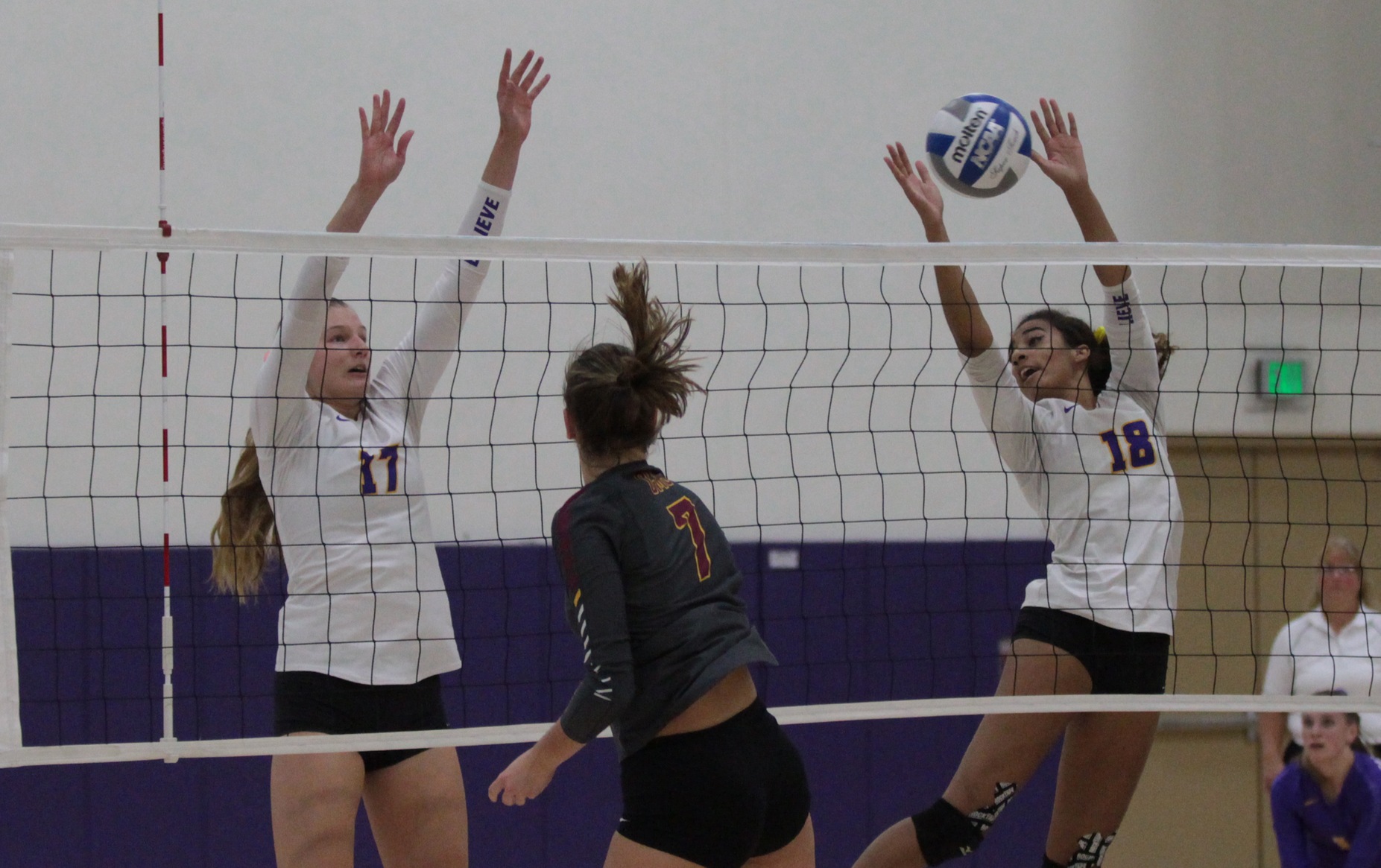 Samantha Landrum and Tylor Johnson combine for a block as the Regals take down CMS 3-2.