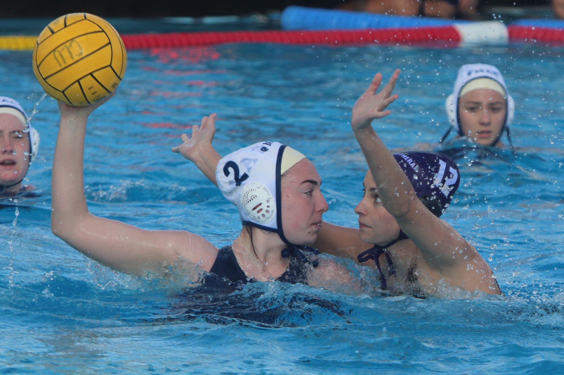 Christin Hirn (purple cap) and the Regals' defense helped Cal Lutheran rout the Occidental Tigers 15-1.